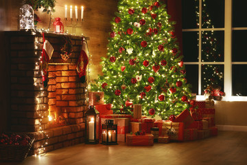 interior christmas. magic glowing tree, fireplace, gifts in dark .