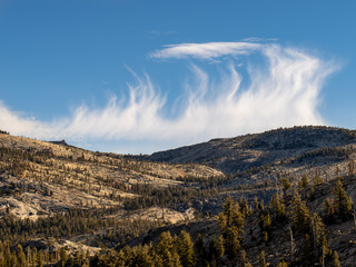 Poster - Rugged granite mountain peak in Yosemite National Park with a vibrant blue sky during autumn