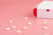 sweetener tablets on pink background