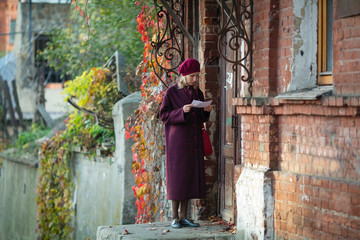 Woman brought the letter to the old house.