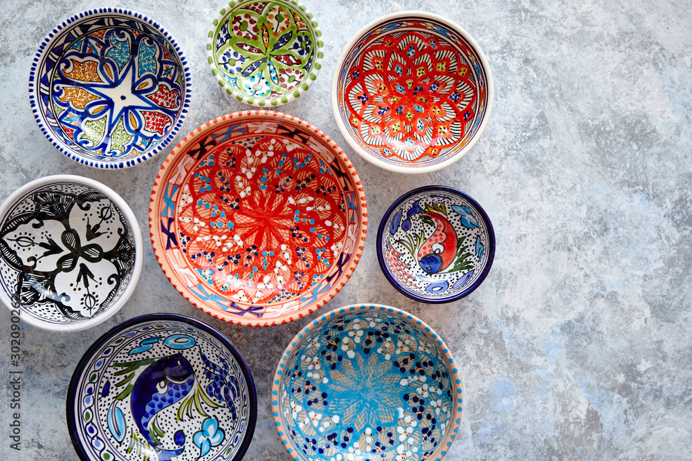 Collection of empty moroccan colorful decorative ceramic bowls - obrazy, fototapety, plakaty 