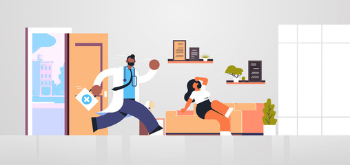 Wall Mural - male doctor with first aid kit running to help woman patient medicine healthcare ambulance concept african american medical worker in white coat living room interior full length flat horizontal vector