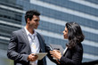 © Atstock Productions - Indian businessman meeting with businesswoman outdoors in the city
