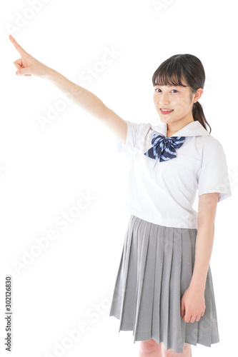 上を指差す制服を着た女子学生stock Photo Adobe Stock