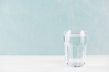 Blue Background With Glass Of Pure Water On The Table