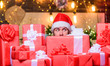 © be free - Holidays filled with fun. Man Santa hat peeking out of pile of gifts. Santa with gifts. Bearded Santa Claus and many holiday packages. Best prices for winter gifts. Seasonal offer. Christmas sale