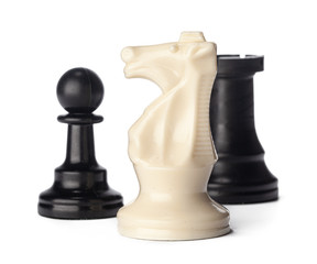 Wall Mural - Black and white chess pieces on white background