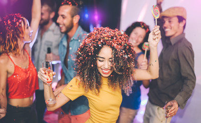 Wall Mural - Happy friends doing party drinking champagne in nightclub - Group young people having fun celebrating new year holidays together in disco club - Youth entertainment lifestyle concept