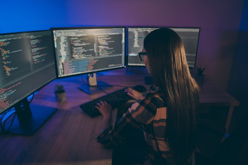 Back rear view photo of serious coder developing new operating system for using on new generation electronic devices
