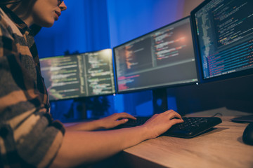 cropped close up photo of interested focused coder hard-working improving security system of her com