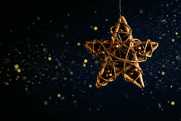 Aufkleber - Golden christmas star on black background