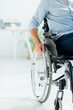 © LIGHTFIELD STUDIOS - partial view of man sitting in wheelchair in living room