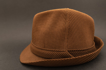 brown retro hat on black background, vintage old hat