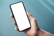 © Wit - Mockup image of woman's hand holding thin bezels mobile phone with blank screen in glossy corporate environment - Image
