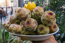 Freshly Picked Artichokes Exposed At The Ghetto, A Popular Jewish Quarter In Rome, Italy. Focus On  Foreground. Close Up