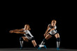© master1305 - Young female volleyball player isolated on black studio background. Woman in sport's equipment and shoes or sneakers training and practicing. Concept of sport, healthy lifestyle, motion and movement.