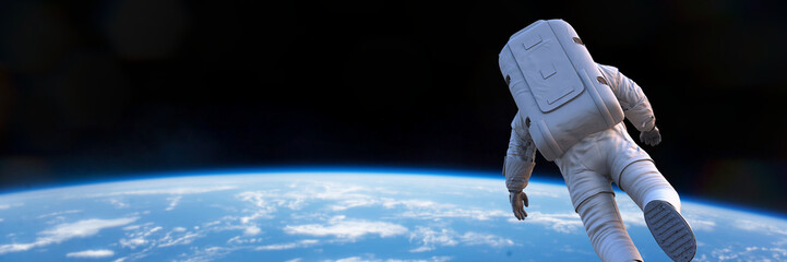 Wall Mural - astronaut performing a spacewalk in outer space