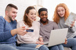 Excited friends planning and buying trip online