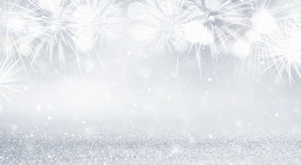 Wall Mural - Silver and white Fireworks and bokeh in New Year eve and copy space. Abstract background holiday.