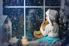 Little Girl Sitting By The Window With A Bear