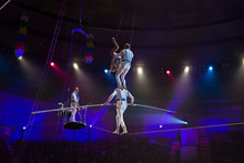 Performance Of Aerialists In The Circus Arena.
