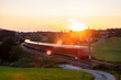 © Westend61 - Germany, Upper Bavaria, Regional train at sunset