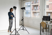 Photographer Standing In His Studio
