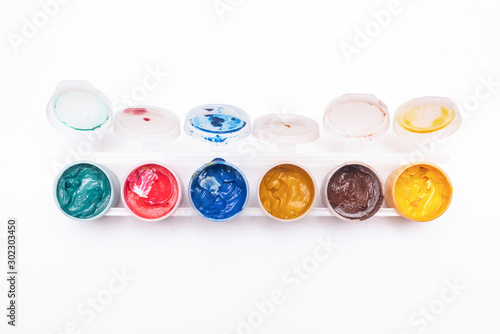 Cuadros en Lienzo Gouache colorful paint in a jar isolated on white background.