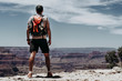 © Juan Miguel Aparicio/ADDICTIVE STOCK - Tourist gazing while standing on edge of picturesque canyon