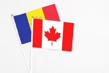 Canada And Andorra Stick Flags On White Background. High Quality Fabric, Miniature National Flag. Peaceful Global Concept.White Floor For Copy Space.