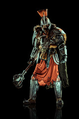 Wall Mural - Powerful knight in the armor with the hammer. Isolated on black background.