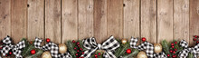 Christmas Border Banner With White And Black Checked Buffalo Plaid Ribbon, Ornaments And Tree Branches. Above View On A Rustic Wood Background.