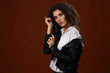 © parsadanov - Beautiful girl in white blouse and black leather jacket