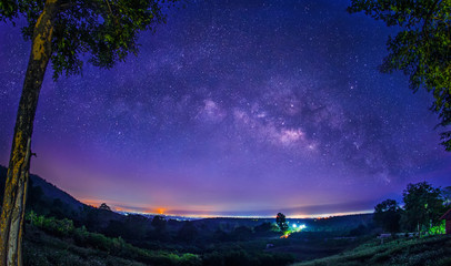 Wall Mural - milky way galaxy on the foothills of the no-hunting zone lamphun, thailand. long exposure photograph