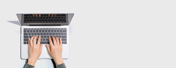 Person using a laptop computer from above