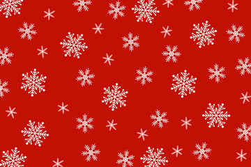 Christmas background of big and small snowflakes, white on red