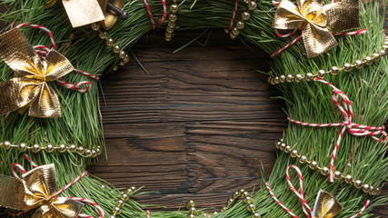 Wall Mural - Christmas background. Christmas wreath with New Year decorations on a wooden background. Copy space for text