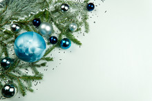 Modern Christmas Composition. Christmas Balls, Blue And Silver Decorations On White Background. Flat Lay, Top View, Copy Space. Close Up Photo. Can Be Used Us Postcard Or Christmas Banner