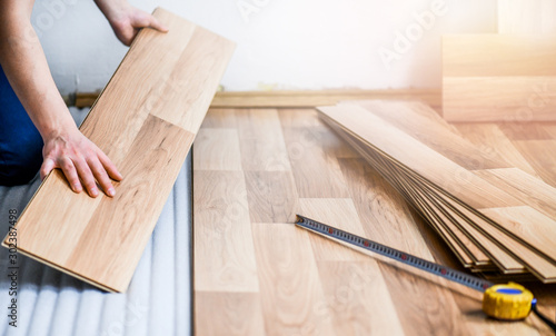 Worker Hands Installing Timber Laminate Floor Wooden Floors House