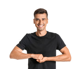 Wall Mural - Young deaf mute man using sign language on white background