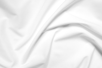 Abstract white fabric texture background. Cloth soft wave. Creases of satin, silk, and cotton.