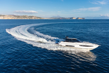 Wall Mural - luxury motor yacht in navigation, aerial view