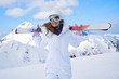 woman skier  wearing white healmet with mask in snow winter mountain