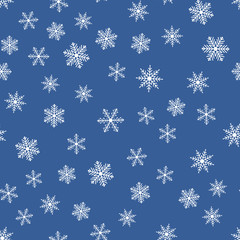 Wall Mural - Seamless pattern with snowflakes on a blue background