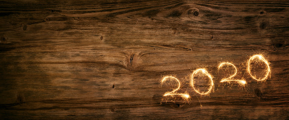Aufkleber - New year 2020 firework on wooden background