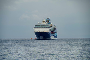 Classic cruise ship Marella Cruises Marella Explorer 2 at sea anchoring seashore of Greek Island Zakynthos on grey and windy day during Fall in the Mediterranean Aegean Sea