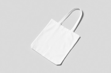 Wall Mural - White tote bag mockup on a grey background.