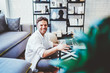 © BullRun - Cheerful caucasian male freelancer enjoying distance job in modern interior apartment , happy hipster guy satisfied with online earnings share content in his blog via laptop computer and wifi.