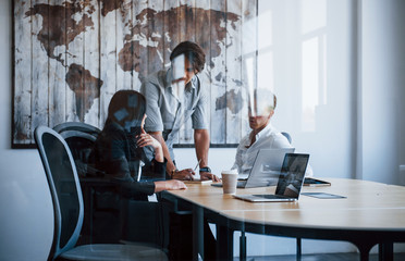 Young business people in formal clothes working in the office