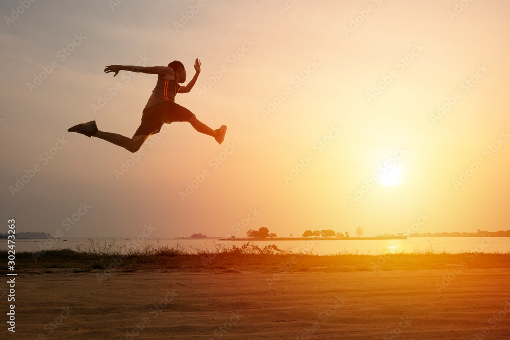 Athlete runner on road with sunset or sunrise , sport and healthy concept - obrazy, fototapety, plakaty 